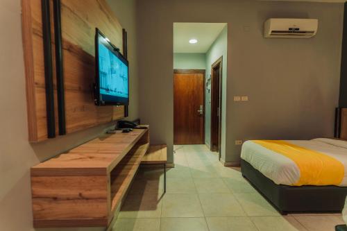 A television and/or entertainment centre at Baden Hotel Suites