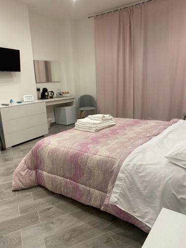 Posteľ alebo postele v izbe v ubytovaní Affittacamere La Riviera