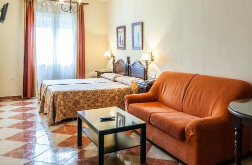 Ένα ή περισσότερα κρεβάτια σε δωμάτιο στο Hotel El Molino
