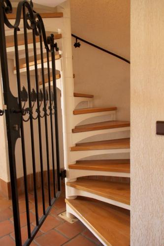 a staircase in a house with wooden stairs at Wooden fairytale in Lesično
