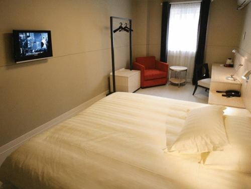 Łóżko lub łóżka w pokoju w obiekcie Jinjiang Inn - Shanghai Qingpu