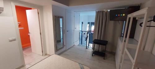 a view of a room with a hallway with a mirror at valencialoft in Valencia