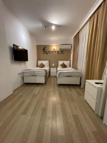 Una cama o camas en una habitación de The Print House Hotel