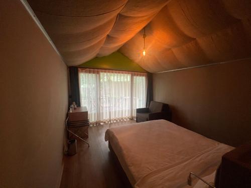 Ένα ή περισσότερα κρεβάτια σε δωμάτιο στο LONGOSPHERE GLAMPING