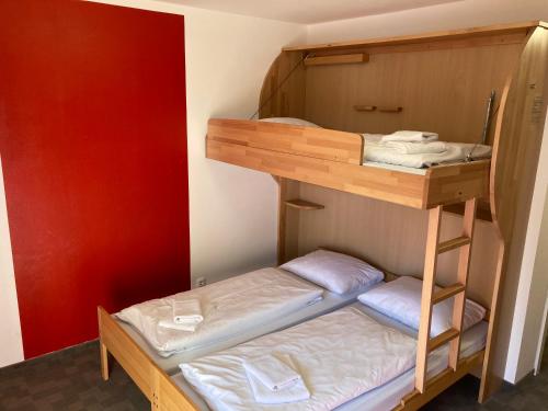 a bunk bed room with two bunk beds in it at ALPEN EXPERIENCE - CVJM Aktivzentrum Hintersee, Jugendgästehaus in Ramsau