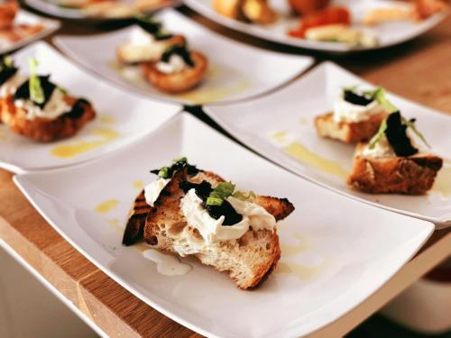 a group of plates of food on a table at Shanti Home in Vieste