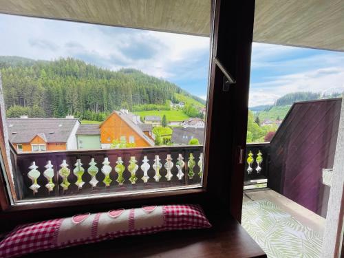 a window with a view of a mountain at Alpenpension Gasthof in Ratten