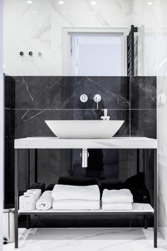 a bathroom with a sink and a mirror at Maritime Residence in Międzyzdroje