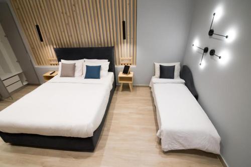 Ліжко або ліжка в номері Preveza Suitestay Apartments Dodonis 28