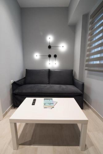 a living room with a couch and a coffee table at Preveza Suitestay Apartments Dodonis 28 in Preveza