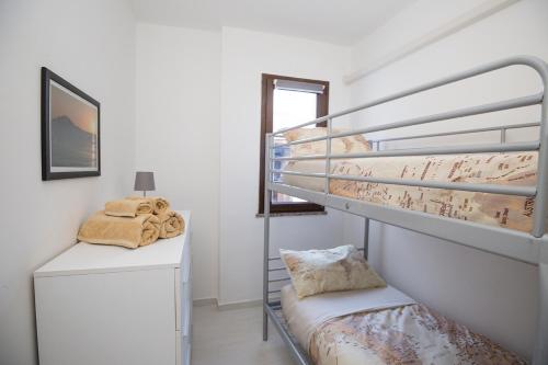 Postel nebo postele na pokoji v ubytování La Piazzetta