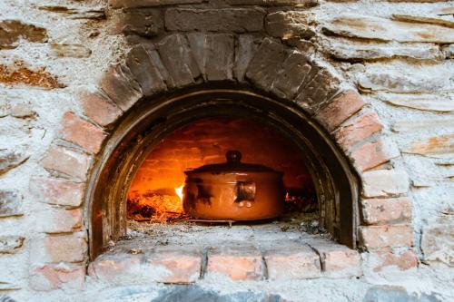 a brick oven with a pot in it at Traditional Apartments Elafos in Elafonisi