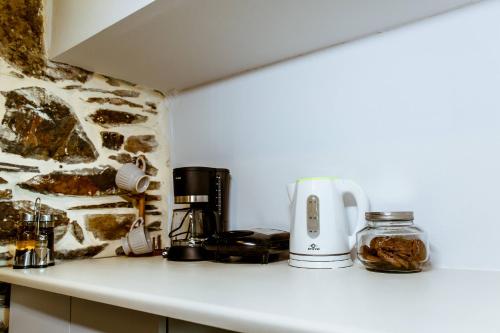 a coffee maker on a counter in a kitchen at Traditional Apartments Elafos in Elafonisi