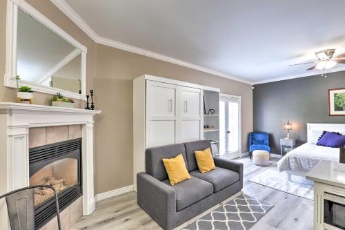 a living room with a couch and a fireplace at Peaceful Midway Studio with Mountain and Golf Views! in Midway