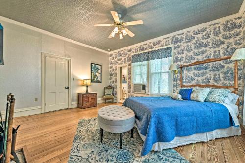 a bedroom with a bed and a ceiling fan at The Lilly House Historic Glen Rose Home with Porch! in Glen Rose