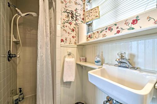 a bathroom with a sink and a shower at The Lilly House Historic Glen Rose Home with Porch! in Glen Rose