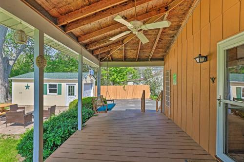 a porch with a ceiling fan on a house at Pet-Friendly Ovid Home Near Seneca Lake and Wineries in Ovid