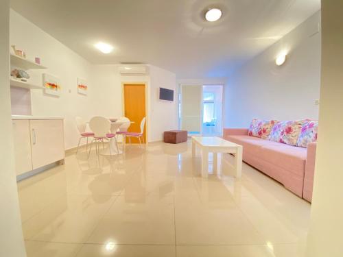 a living room with a couch and a table at Apartman Krešo in Makarska