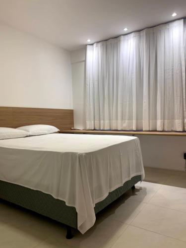 Cama o camas de una habitación en Ótimo Apartamento no coração da Ponta Verde