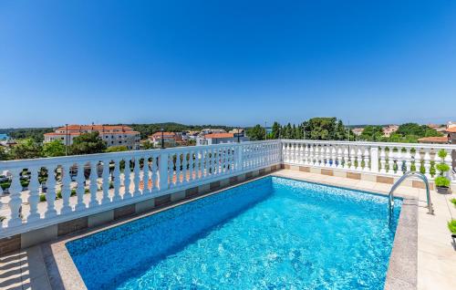 a swimming pool on the balcony of a building at Villa San Rocco Bed & Breakfast in Medulin