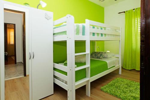 Postel nebo postele na pokoji v ubytování Apartman Miranda