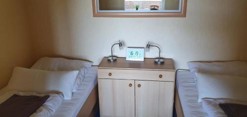 En eller flere senge i et værelse på Ferienwohnung Harz