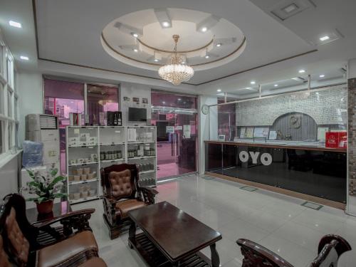 a room with a table and chairs in a store at OYO 700 Pj Inn Hotel in Pampang