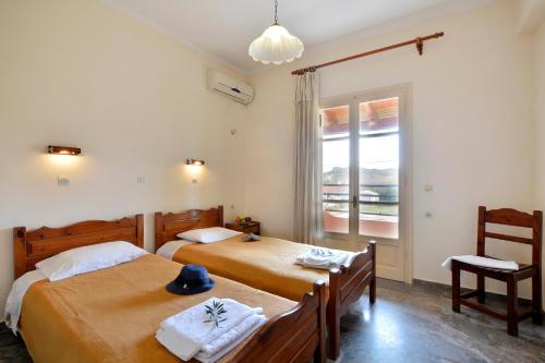 Postel nebo postele na pokoji v ubytování Adonis Apartments