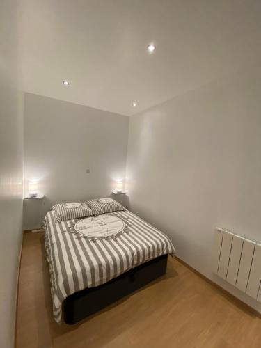 Кровать или кровати в номере Appartement cosy au cœur des Vosges
