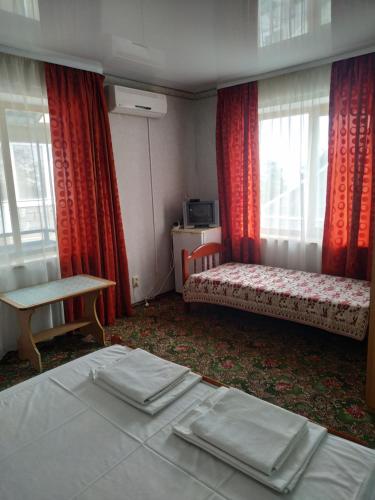 Самарский дом tesisinde bir odada yatak veya yataklar