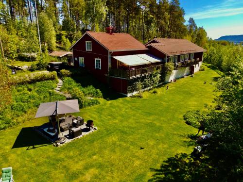 an aerial view of a house with a yard at Kullerbacka Gästhus in Segersta