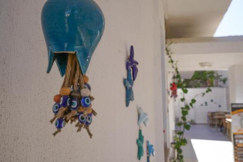 a wall with a bunch of decorations on a wall at Arden Hotel in Didim