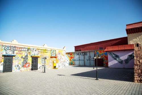 a building with a mural on the side of it at Oscar Hotel by Atlas Studios in Ouarzazate