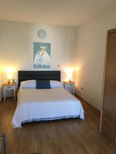 Postel nebo postele na pokoji v ubytování Amelia Apartment