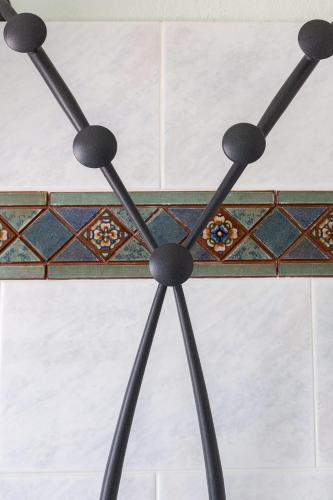 a metal tripod with a tiled floor at Locazione Turistica da Placida in Suni