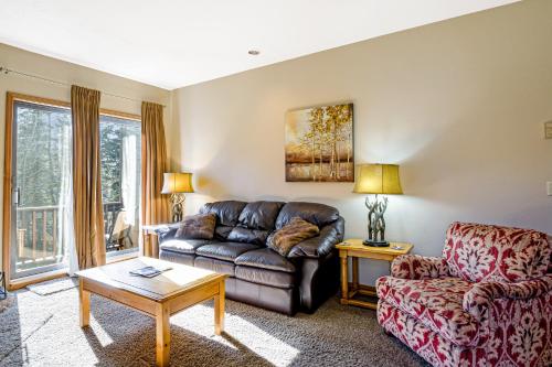 a living room with a couch and a table at Cascade 347 in Durango Mountain Resort