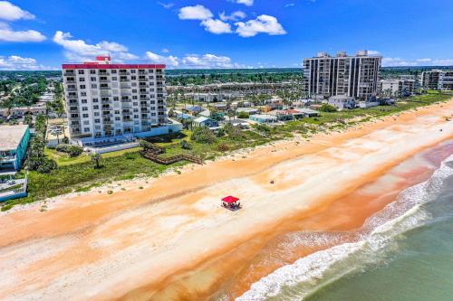 an aerial view of a beach with buildings at Sand and Sea Enjoyment Retreat in Ormond Beach