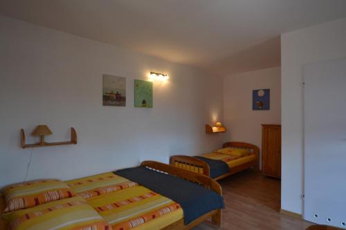 a bedroom with two beds in a room at Dom Gościnny Przystań in Międzywodzie