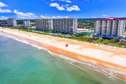 an aerial view of a beach and buildings at Sand and Sea Enjoyment Retreat in Ormond Beach