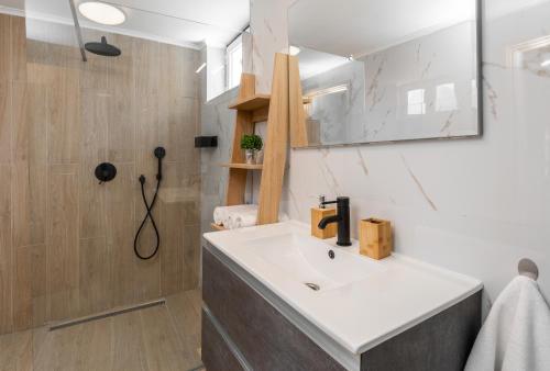 a bathroom with a sink and a shower at APARTMENT TOMA in Vela Luka