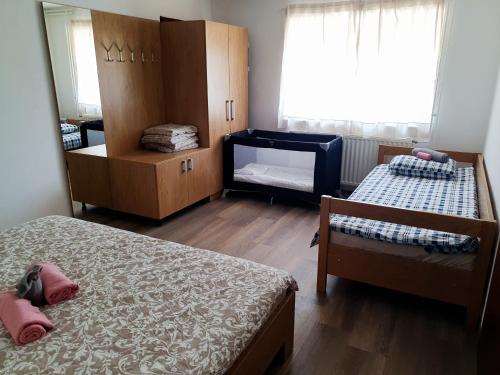 a small bedroom with two beds and a window at APARTMA NANA STRUNJAN in Portorož