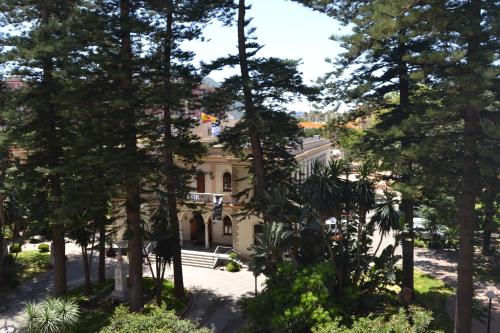 a house in the middle of trees at Hotel Miramar in La Línea de la Concepción