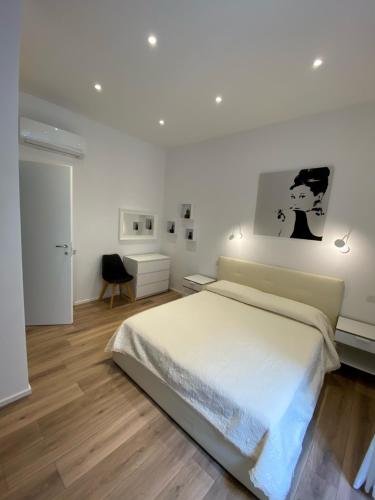 A bed or beds in a room at Alloggio al mare