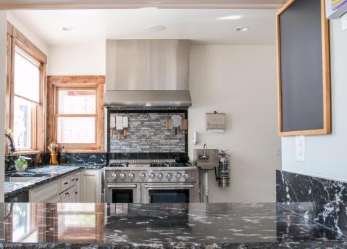 a kitchen with a stove and a counter top at Clear Creek Inn in Georgetown