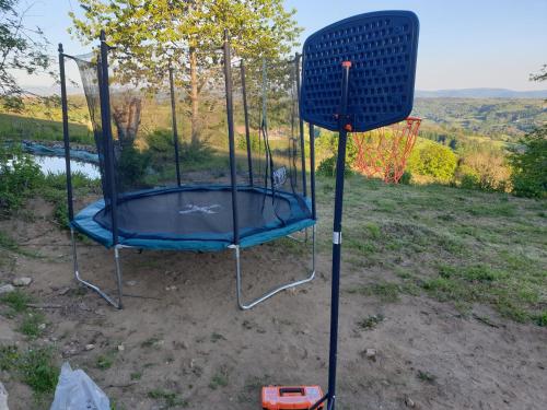 a trampoline in the middle of a yard at Gite Ferme Brelouffe 1 in La Rosière