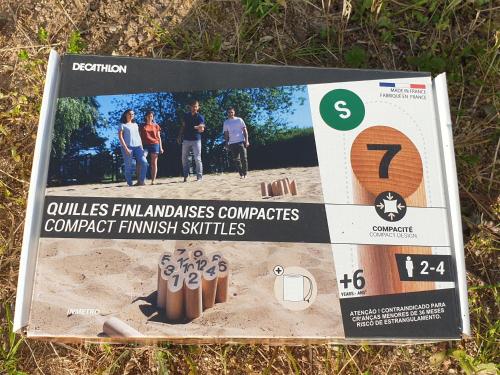 a sign on the ground with people standing in the sand at Gite Ferme Brelouffe 1 in La Rosière