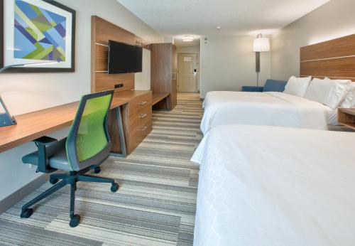 a hotel room with two beds and a desk at Holiday Inn Express - Hope by IHG in Hope