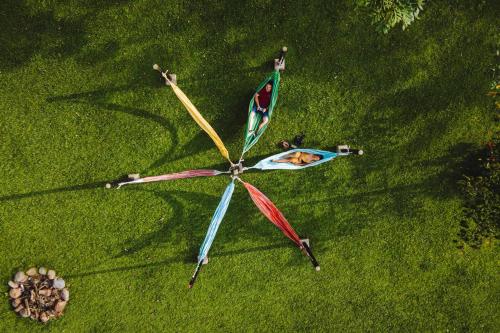 a group of people making a kite in the grass at Hotel Mi Monaco in Pueblo Tapao