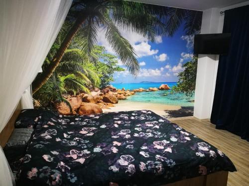 a bedroom with a bed with a view of the ocean at Iași Jacuzzi Apartment F in Iaşi