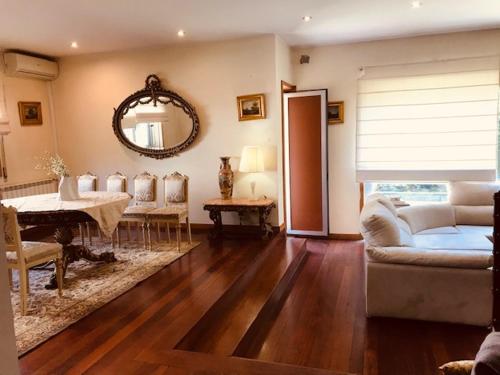 a living room with a couch and a table at Bracara luxury guesthouse in Braga
